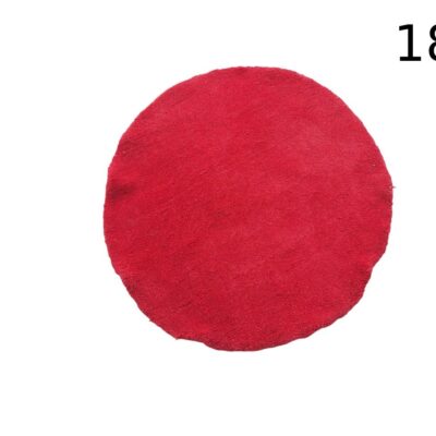 Round deep red carpet with short pile, designed to add a modern and cosy touch to any space in your home, for rent for events, advertising, films and series.