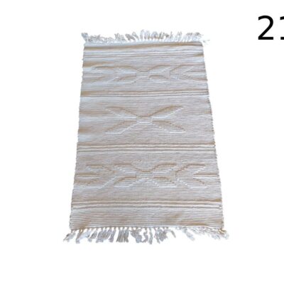 Berber style cotton carpet with fringes on the ends for rent for events, advertising, films and series.