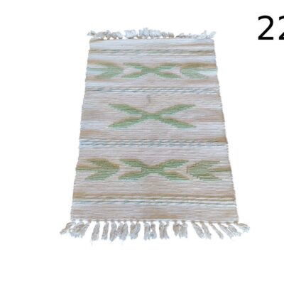 Rug is a hand-woven röllakan style rug with geometric motifs and fringes for rent for events, advertising, films and series.