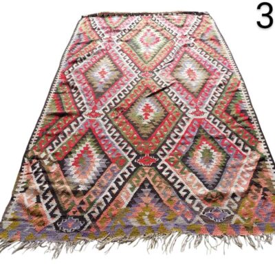 Handmade vintage Turkish Kilim rug with wool and a geometric diamond pattern for rent for events, advertising, films and series.
