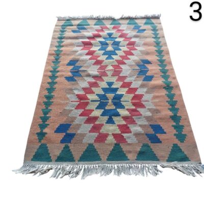 Handmade flat weave Kilim rug with a colourful geometric pattern for rent for events, advertising, films and series.