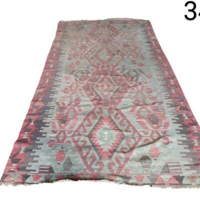 Vintage Turkish Kilim rug handmade with wool and a geometric design for rent for events, advertising, films and series.