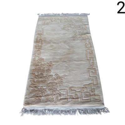 Beige carpet with fringes and carved floral design for rent for events, advertising, films and series.