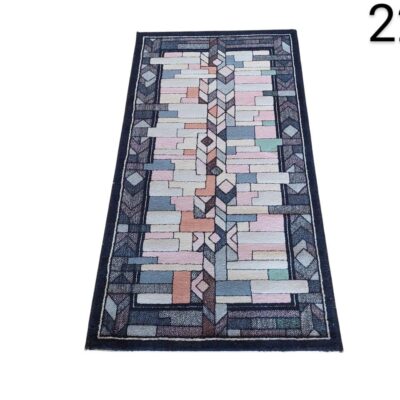 Handmade wool rug with geometric print by Iles for Tisca for rent for events, advertising, movies and series.
