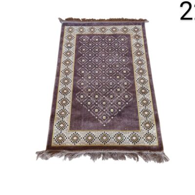 Afghan wool rug with a traditional geometric design in shades of burgundy, brown and cream for rent for events, advertising, film and series.
