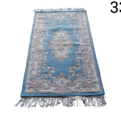 Aubusson style woollen carpet with traditional floral design and fringed edges for hire for events, advertising, films and series.