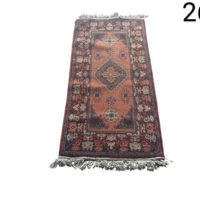 Hand-knotted woollen rug featuring a traditional geometric design with a central medallion, characteristic of Persian or Turkish styles of the mid-20th century, rental for events, advertising, films and series.