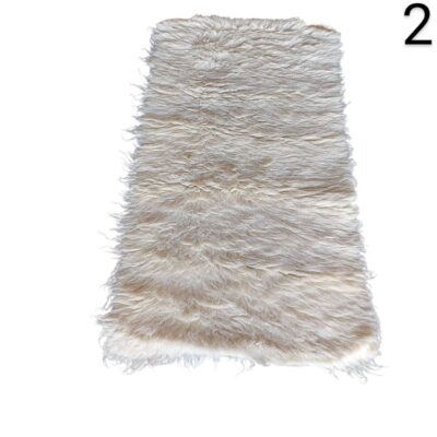 Tibetan sheepskin rug in beige or cream with long curly pile for rent for events, advertising, films and series.