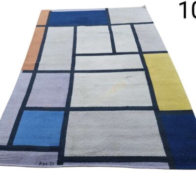 Alfombra inspirada en la "Composición con rojo, azul, negro, amarillo y gris" de Piet Mondrian, producida por Ege Axminster como parte de su colección Masters del siglo XX.  alquiler para eventos, publicidad, pelicula y series