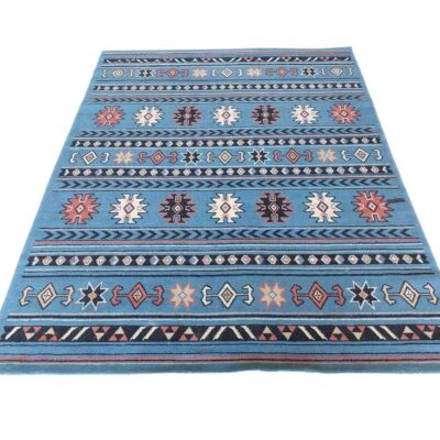 Alfombra tipo Kilim con diseño geométrico y tonalidades azules alquiler para eventos, publicidd, peliculas y series