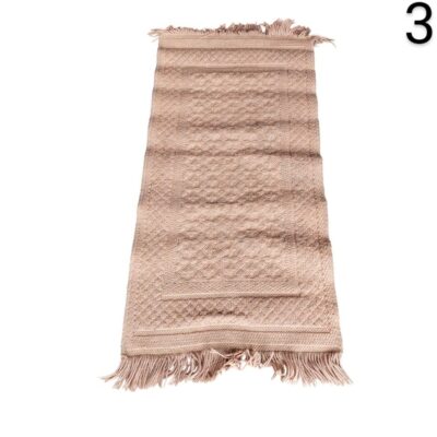 Beige textile carpet with fringes and a subtle textured pattern for rent for events, advertising, films and series.